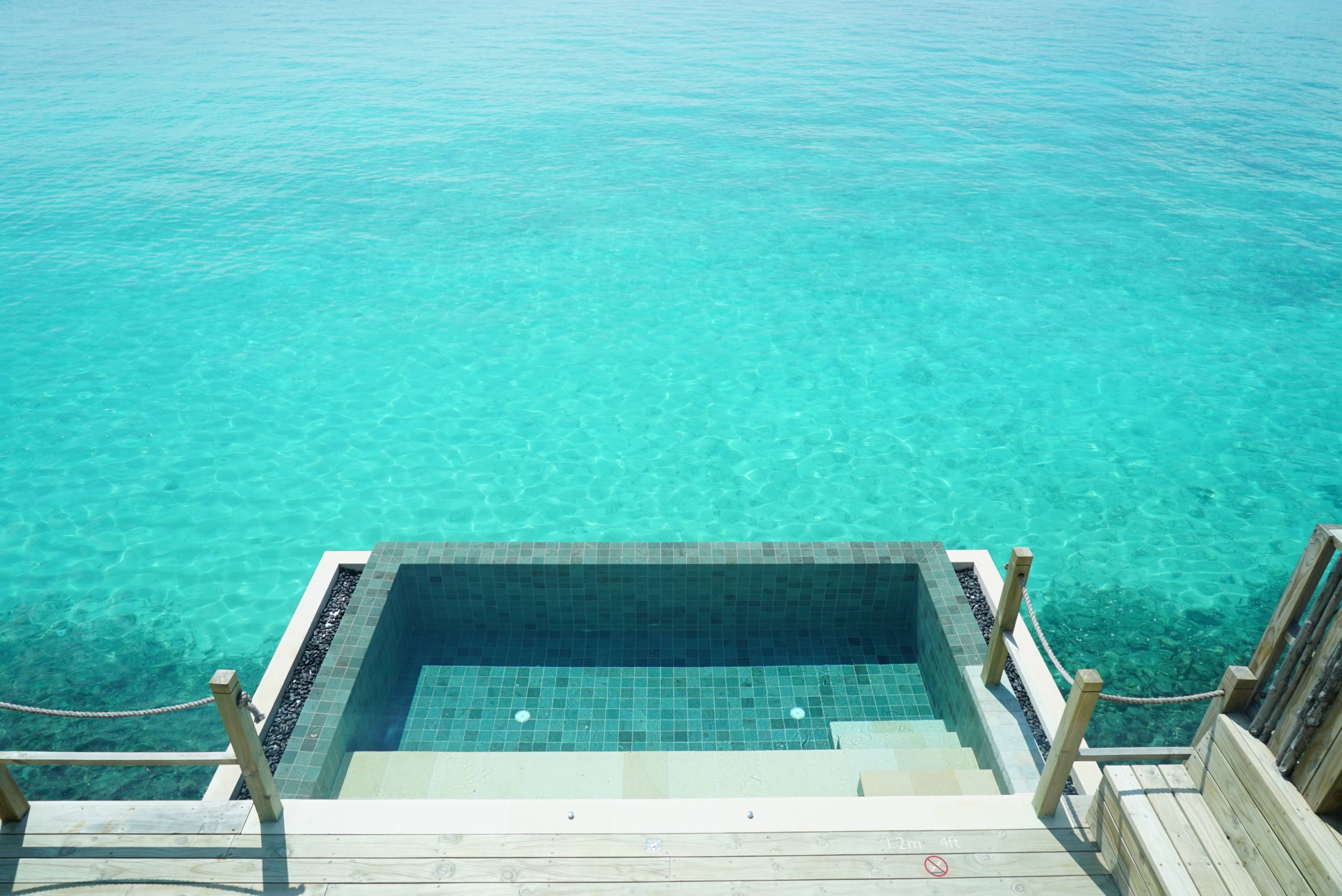 Sunset one-bedroom lagoon pool villa at InterContinental Maldives Maamunagau Resort