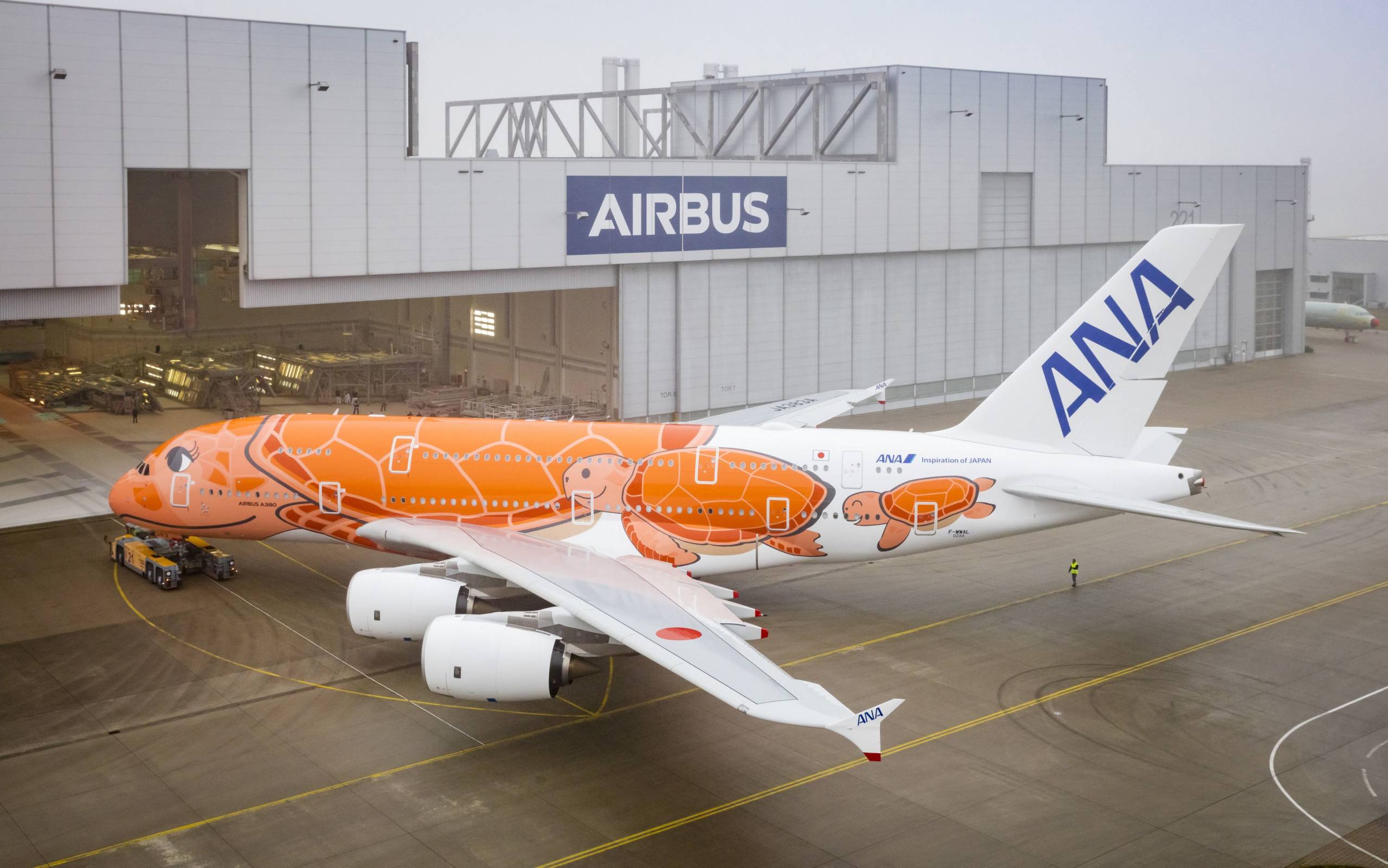 Final ANA A380 rolls out of Airbus hangar in special orange livery ...