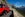 Glacier National Park's famous Red bus on mountain road. (Photo courtesy Xanterra Travel Collection)