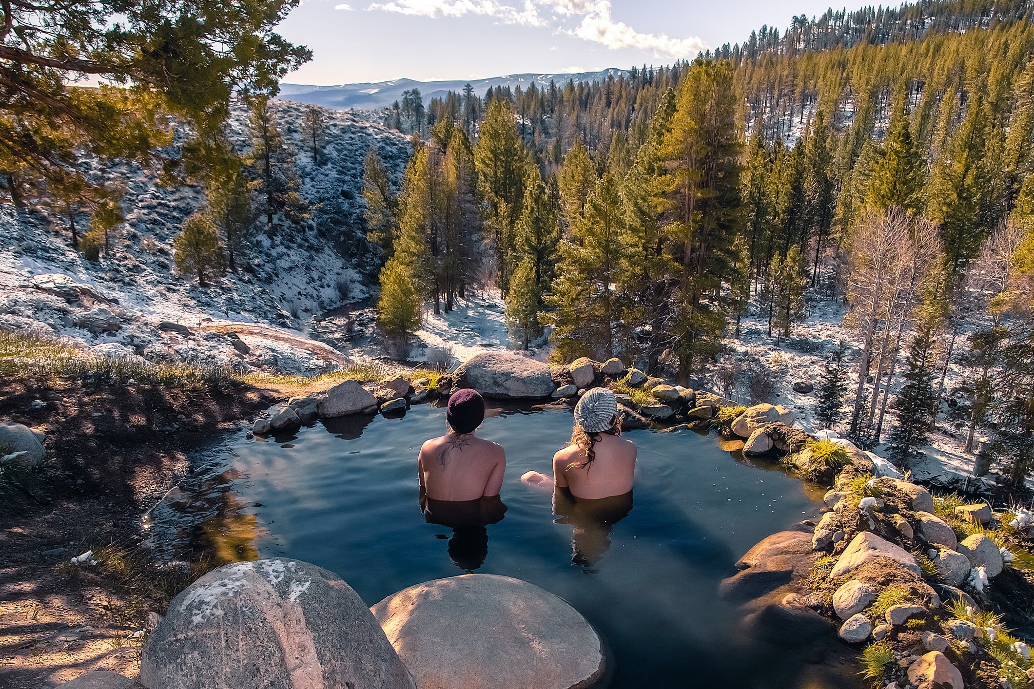 Tourists relaxing in hot spring near Bridgeport, California, USA