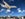 Plane flying over beach by Erin Carey