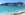 Maho Beach water photo with hotel in background by Erin Carey
