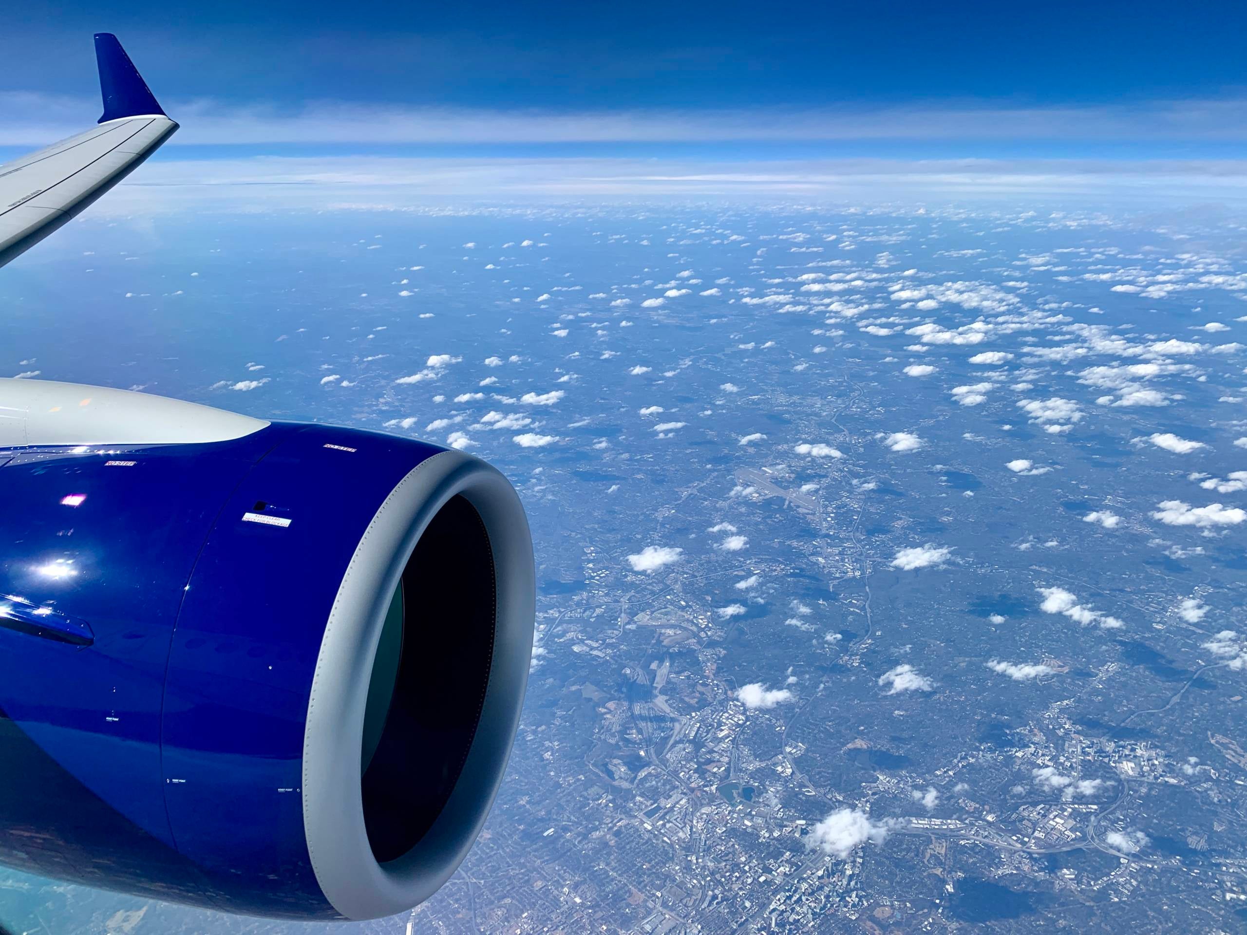 delta-a220-overhead-clouds