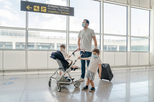 Family travelling with face masks for COVID-19