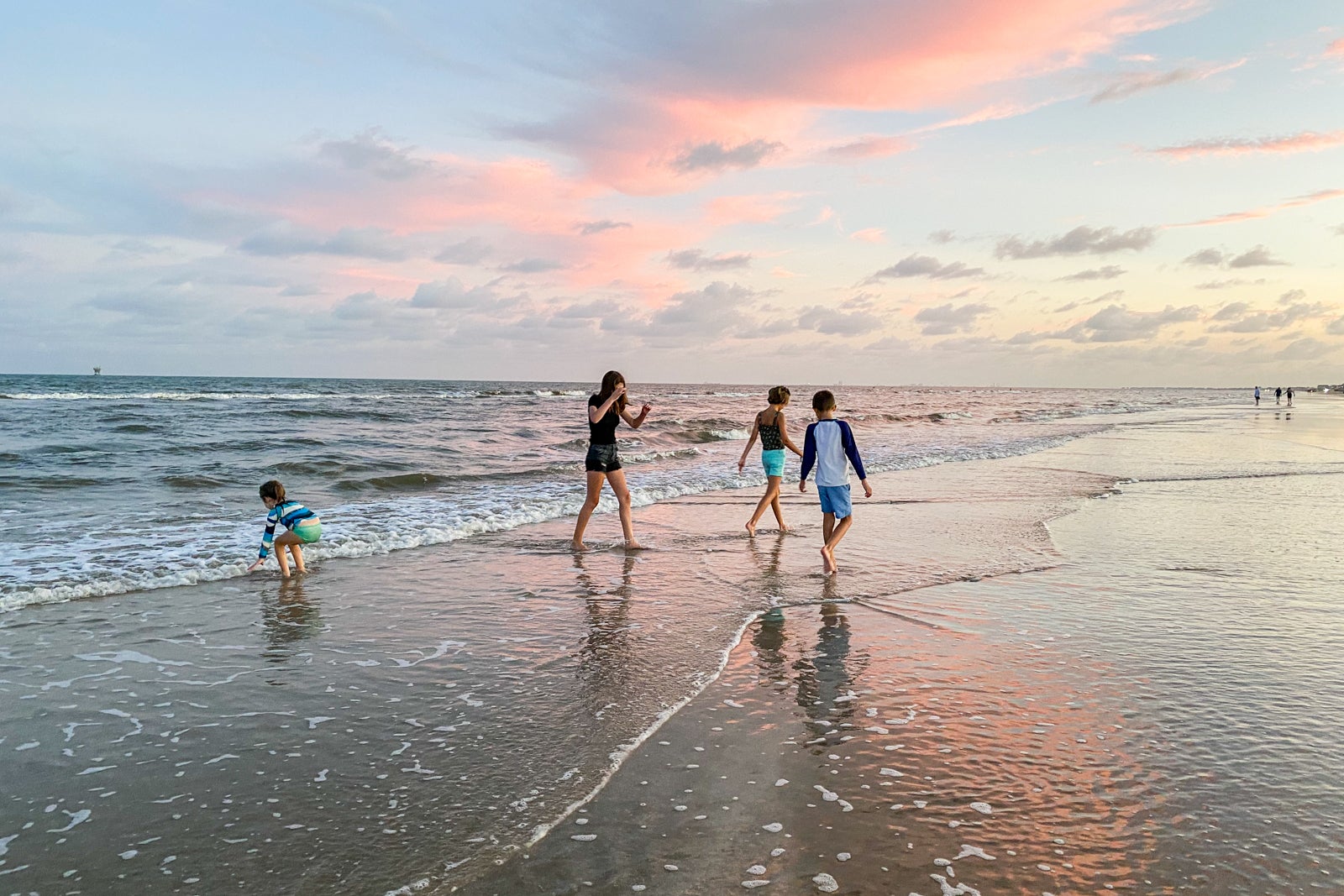 A family walks on a beach