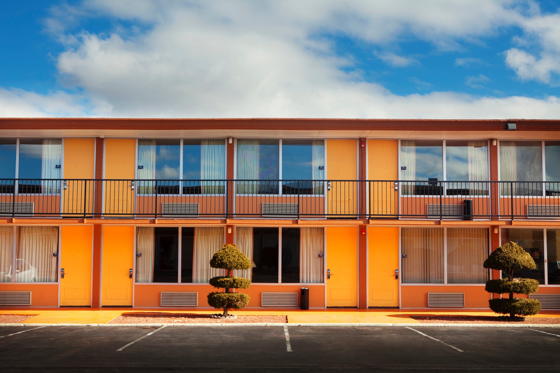Parking lot, doors and windows of motel
