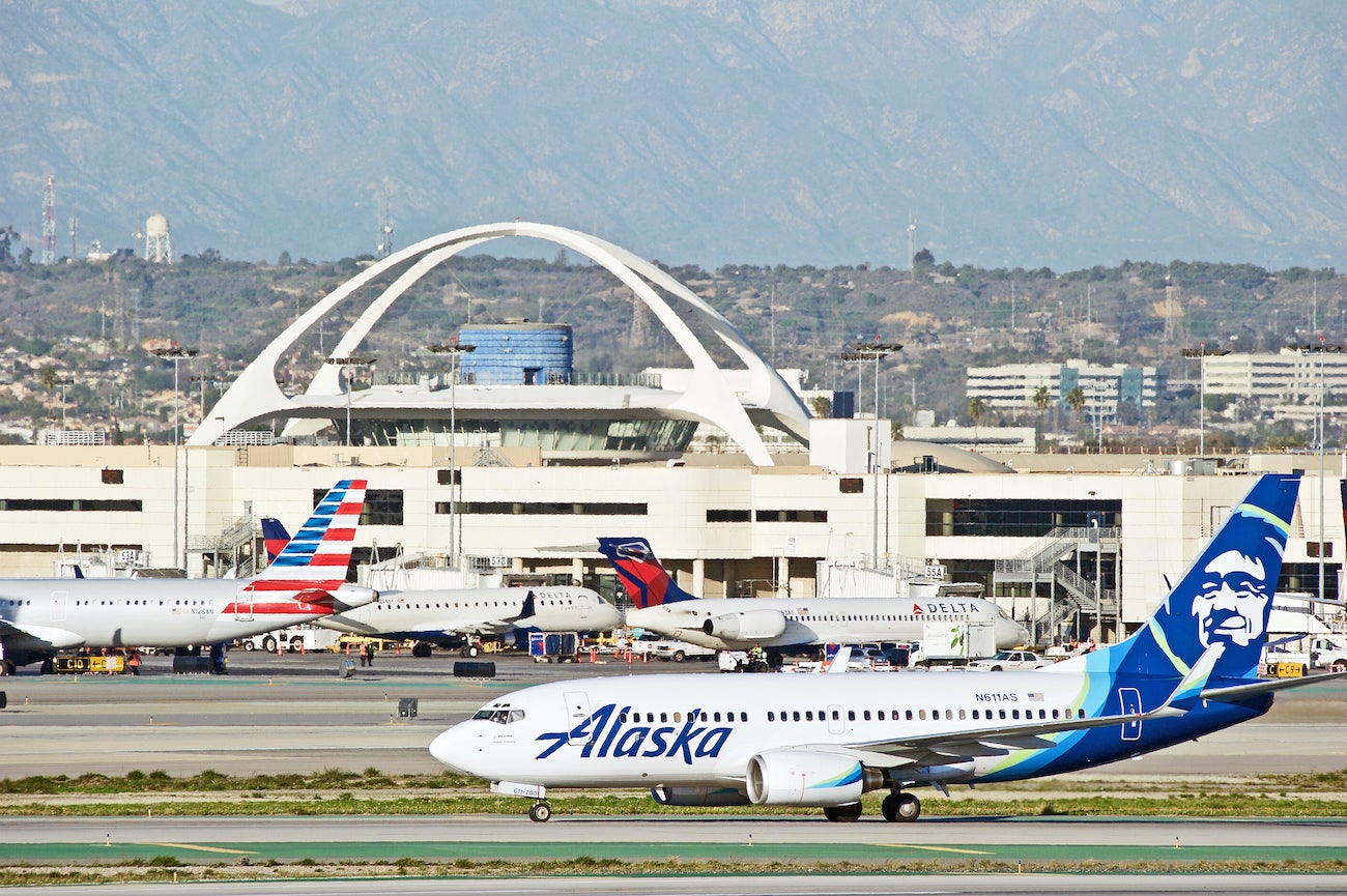 Airplanes at LAX Airport with Alaska Airlines 737 in Front