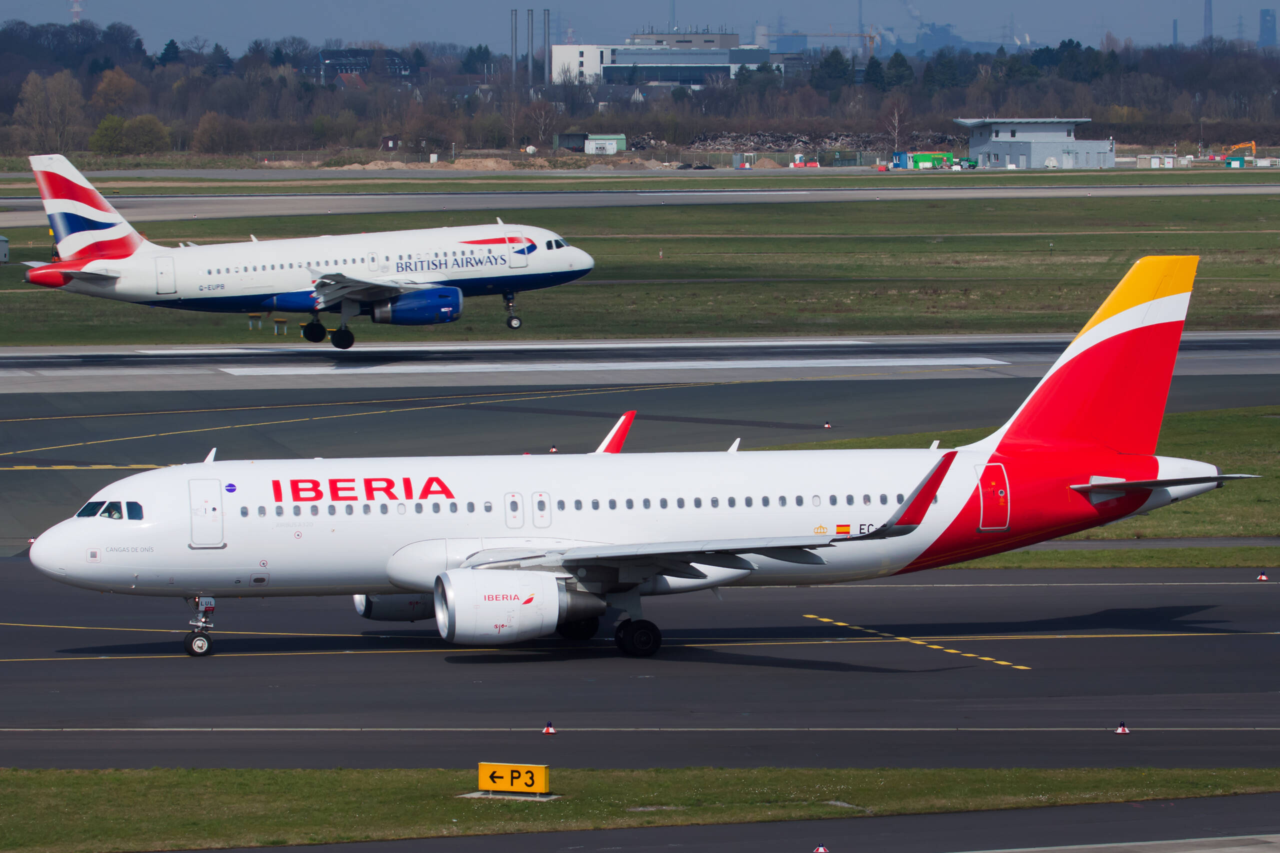 Iberia and British airways planes on the runway
