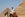 A mask-clad camel guide rides a camel near the Great Pyramid of Khufu (Cheops) and Pyramid of Khafre (Chephren) at the Giza Pyramids on July 1, 2020 (Photo by Khaled DESOUKI / AFP) (Photo by KHALED DESOUKI/AFP via Getty Images)