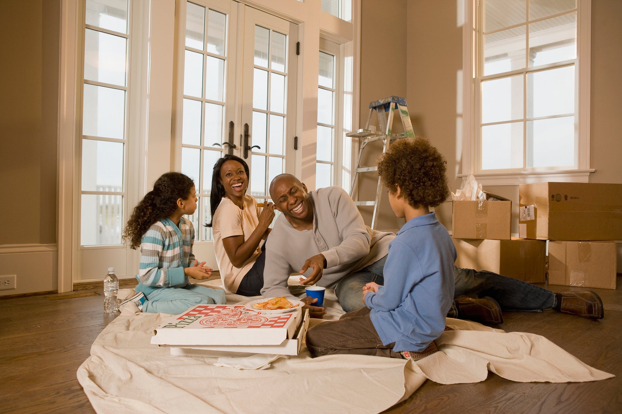 Family on the floor of a new house