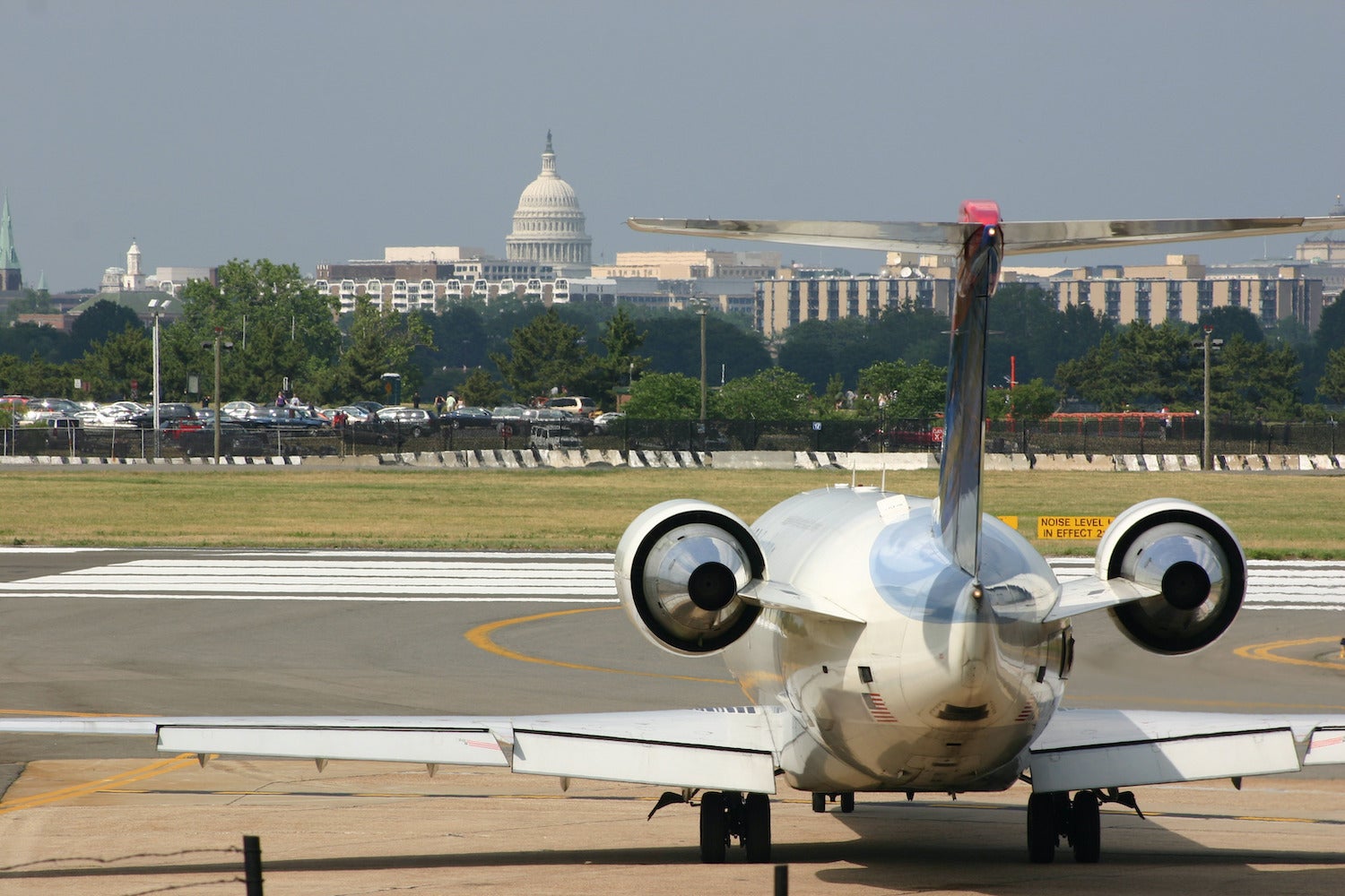 Airplane at DCA airport with the US Capital in the background