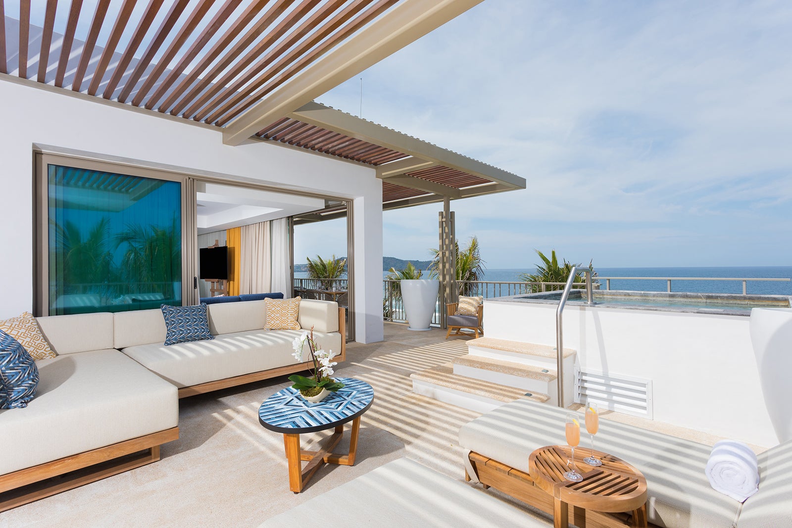 Hotel suite patio with a plunge pool overlooking the ocean