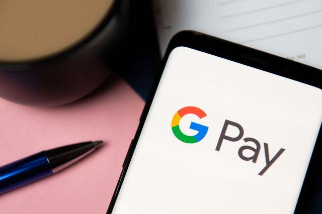 In this photo illustration a Google Pay logo displayed on a