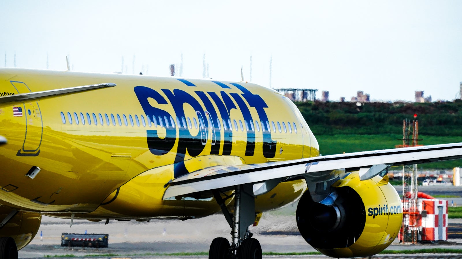 A Spirit Airlines aircraft takes off at La Guardia Airport