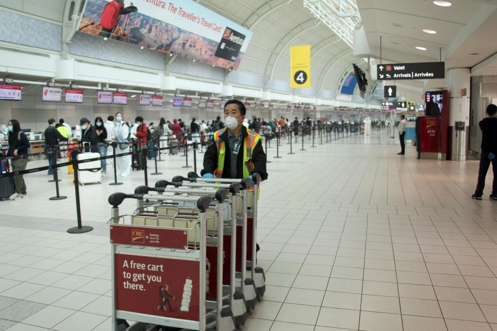 Breaking Canada to enforce hotel quarantine for arrivals, ban travel