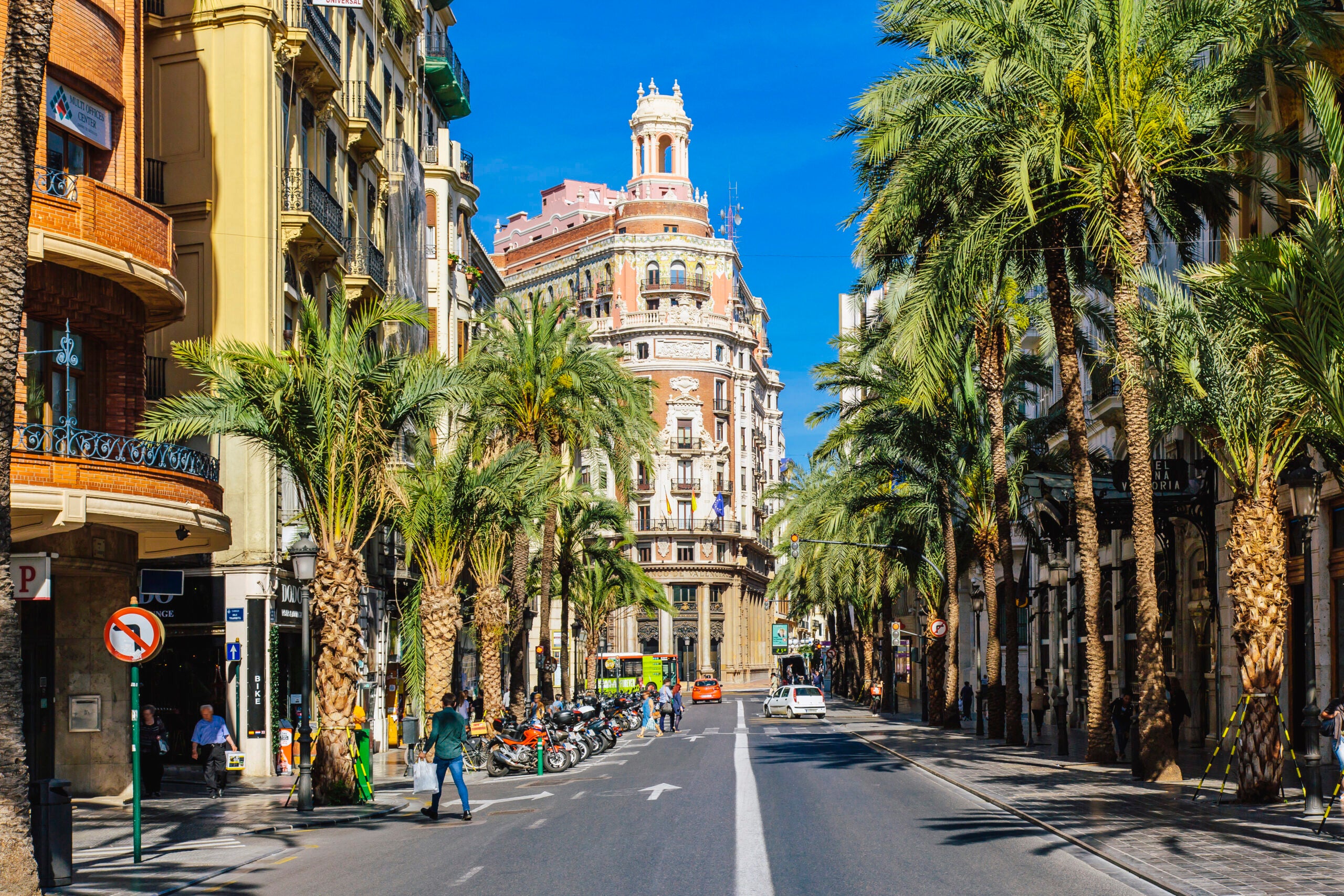 Сarrer de les Barques street with palm trees on a sunny day in Valencia, Spain