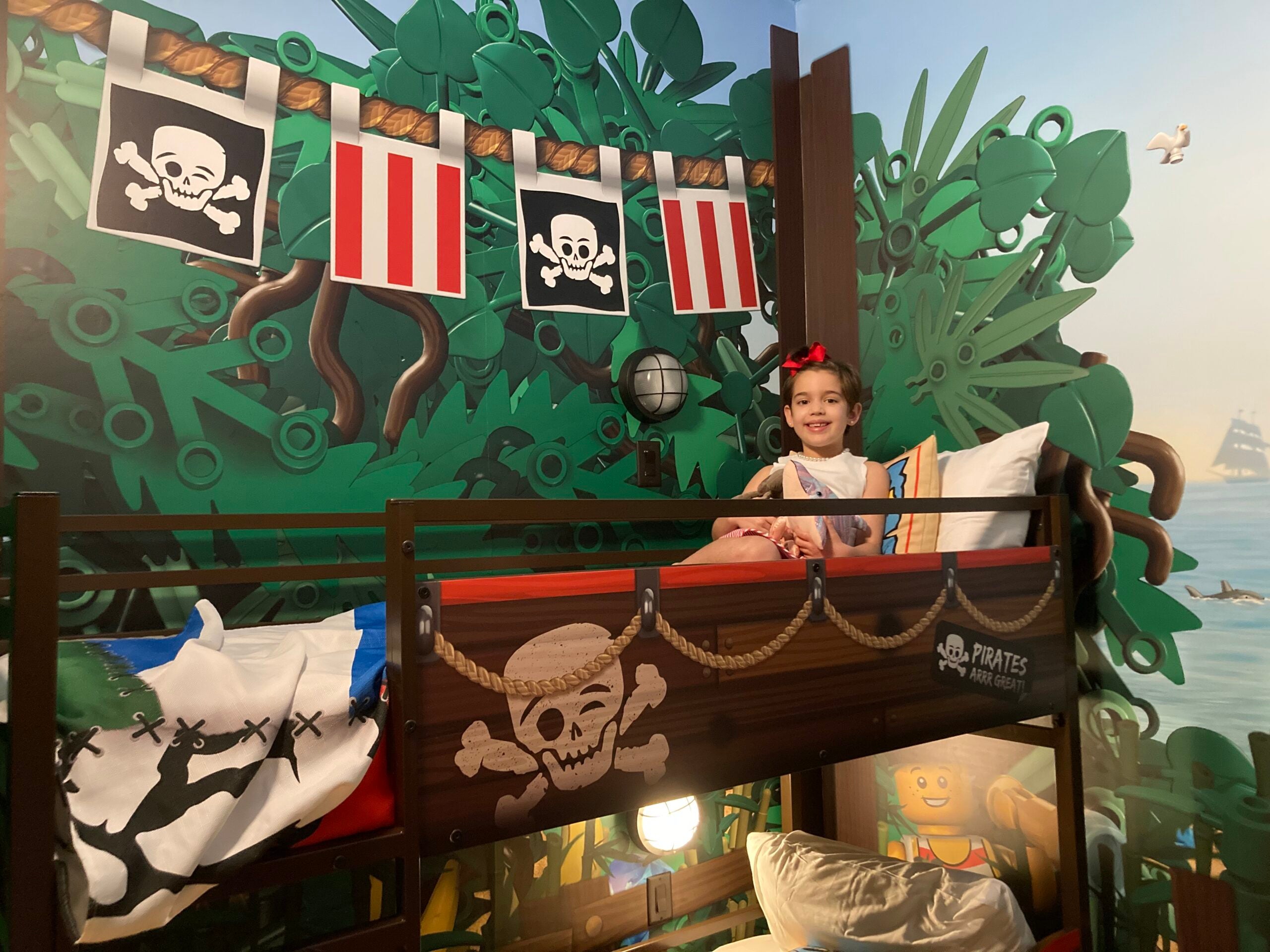The author's daughter in her bed at Pirate Island Hotel at Legoland Florida