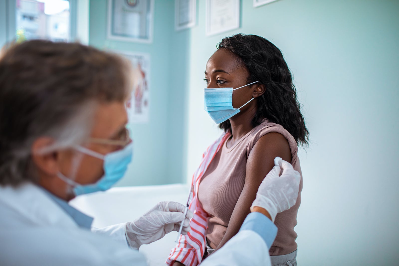 Young woman getting vaccinated