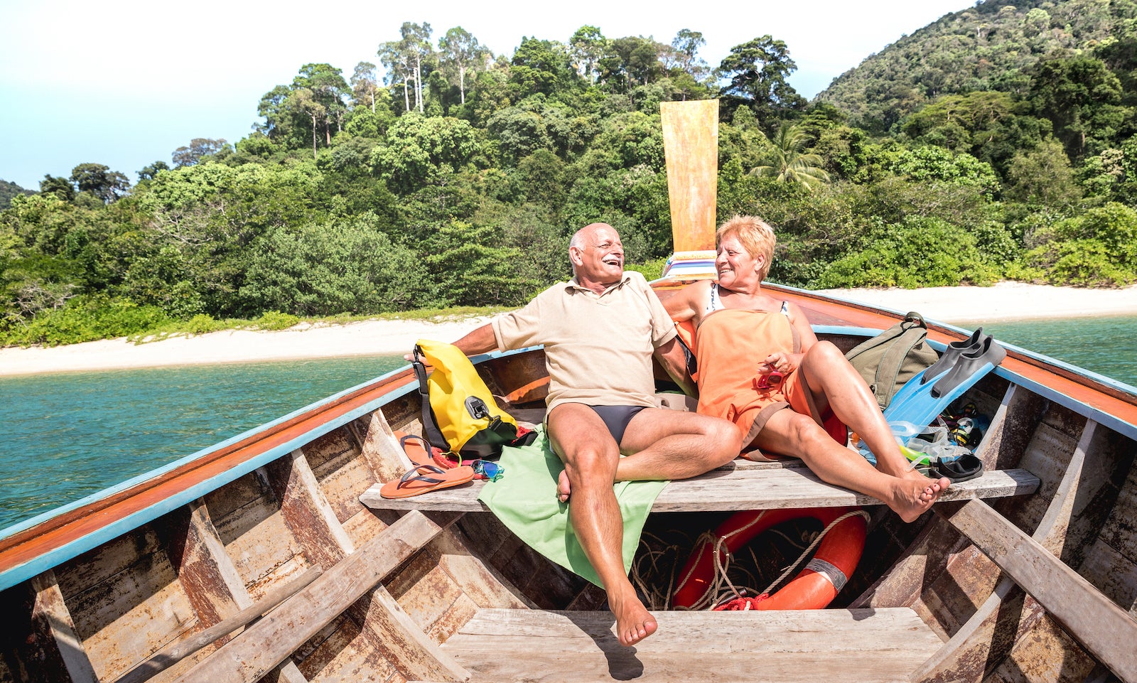 senior couple sitting in boat