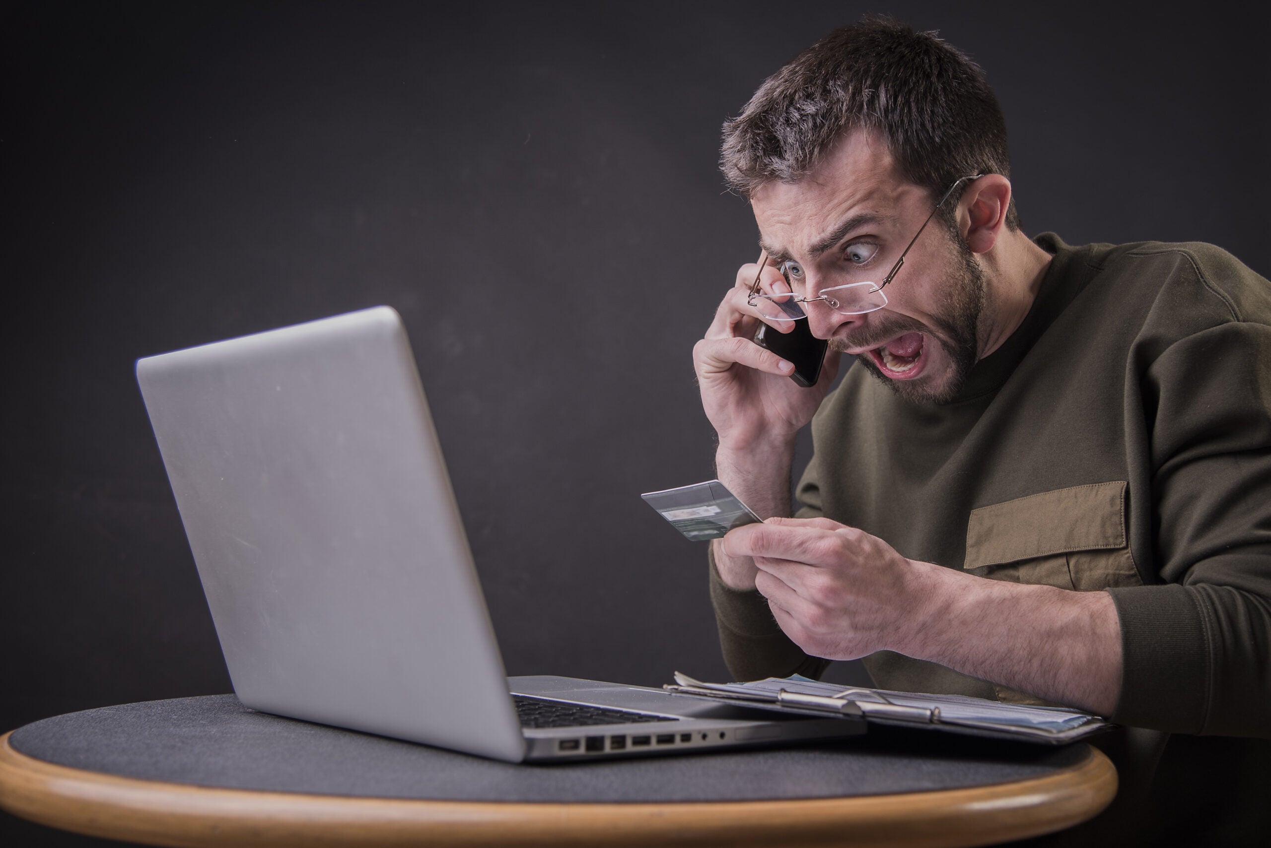 Young,Man,Angry,With,Bank,About,His,Credit,Card,Bill