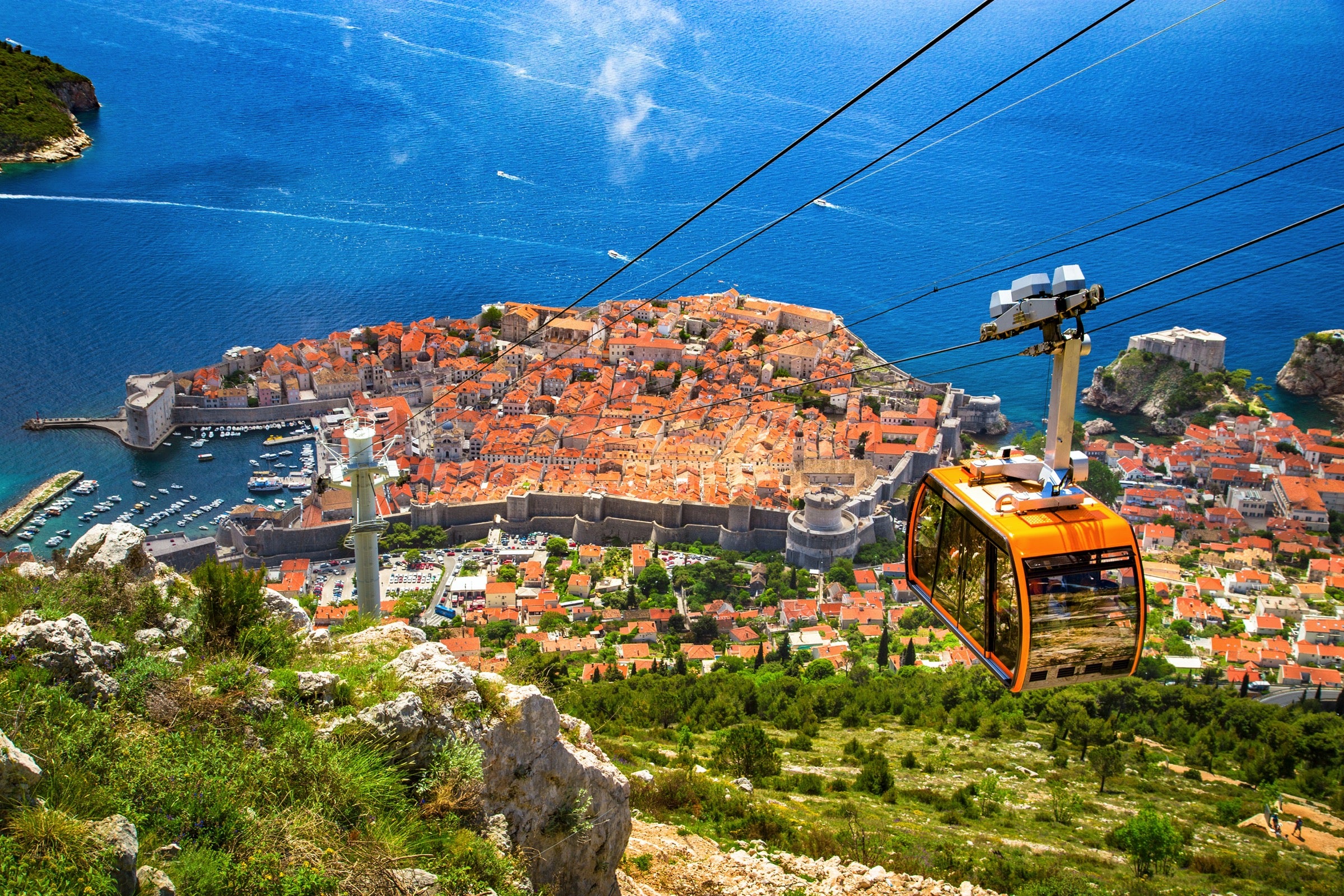 Aerial view of Dubrovnik's old town with a cable car