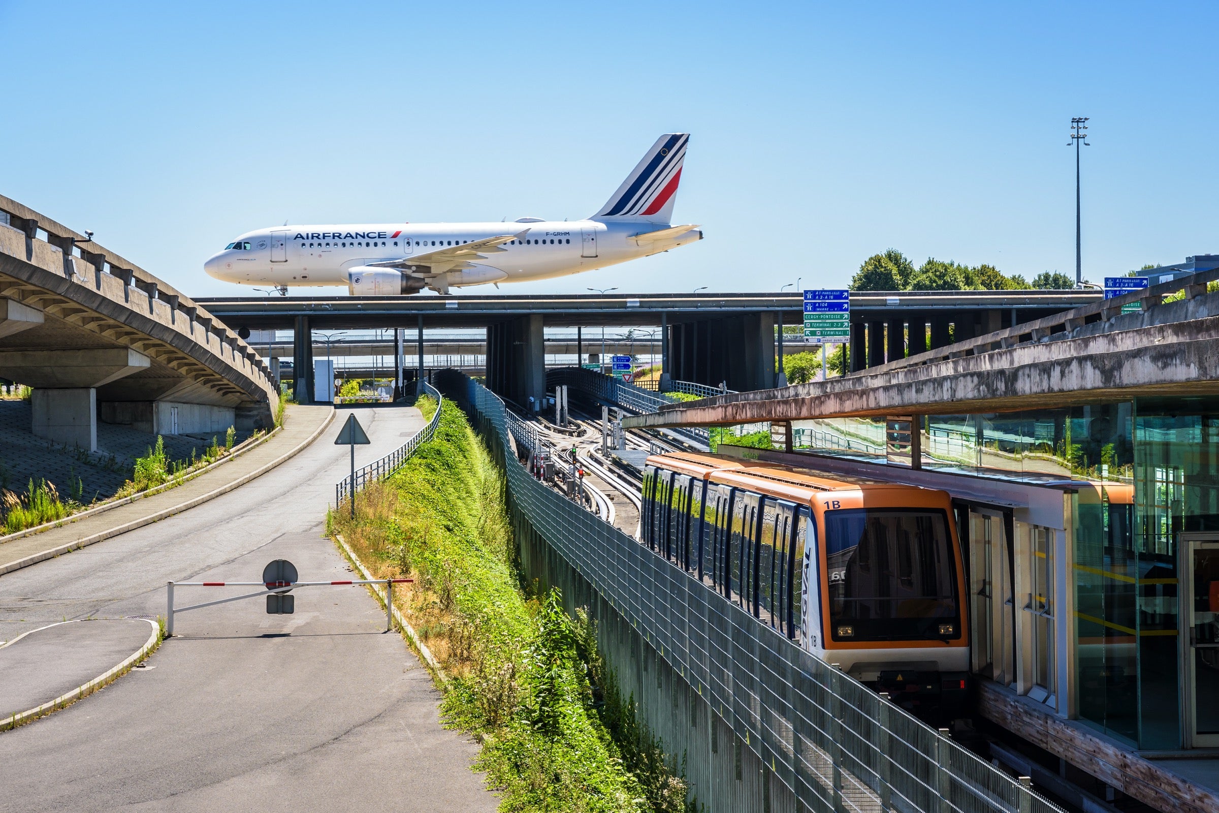 Air France plane and a train at CDG airport