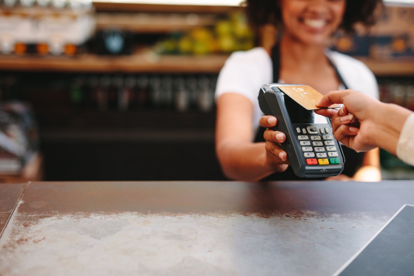 Customer,Making,Wireless,Or,Contactless,Payment,Using,Credit,Card.,Smiling