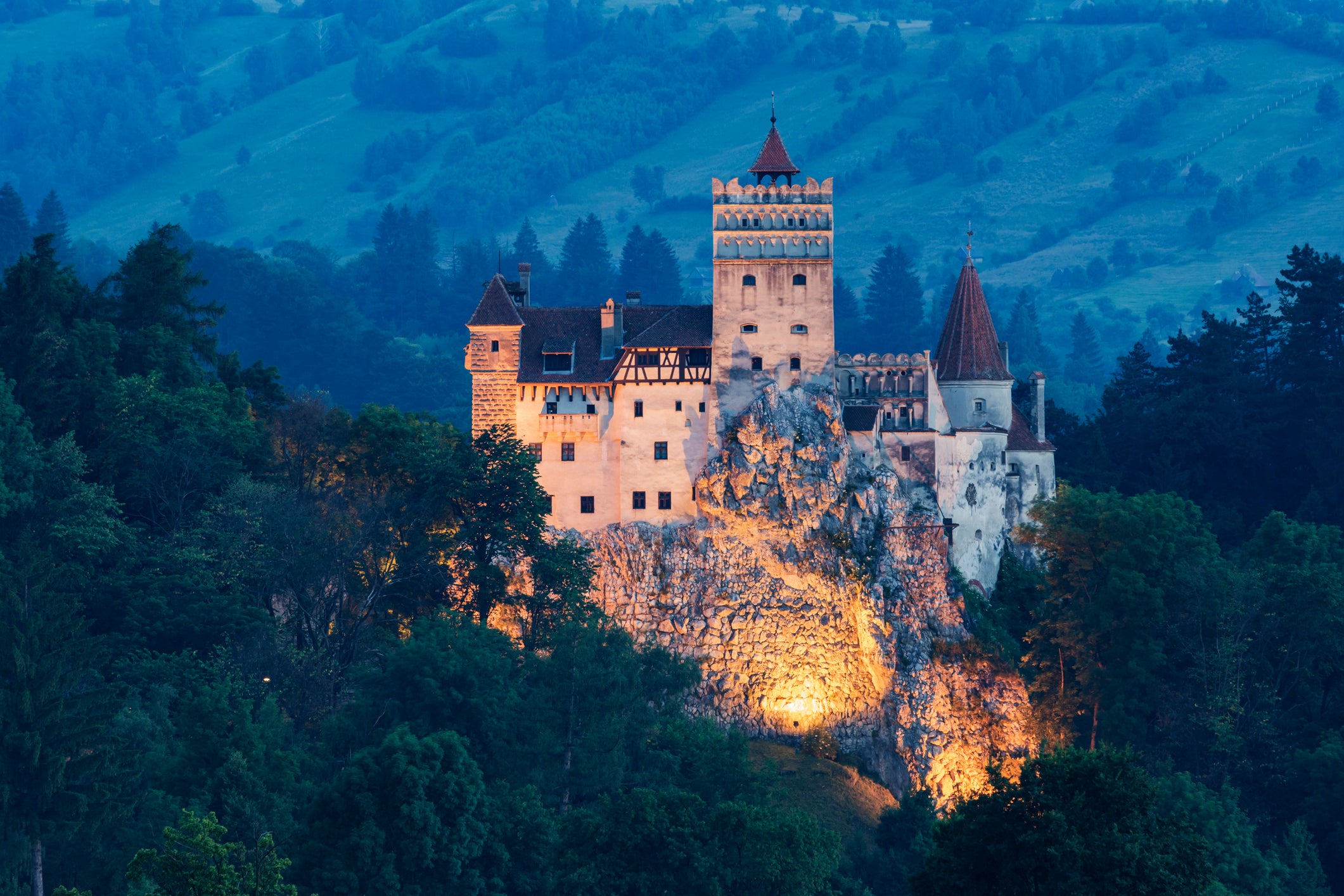 Illuminated castle on hill, Bran, Transylvania, Romania