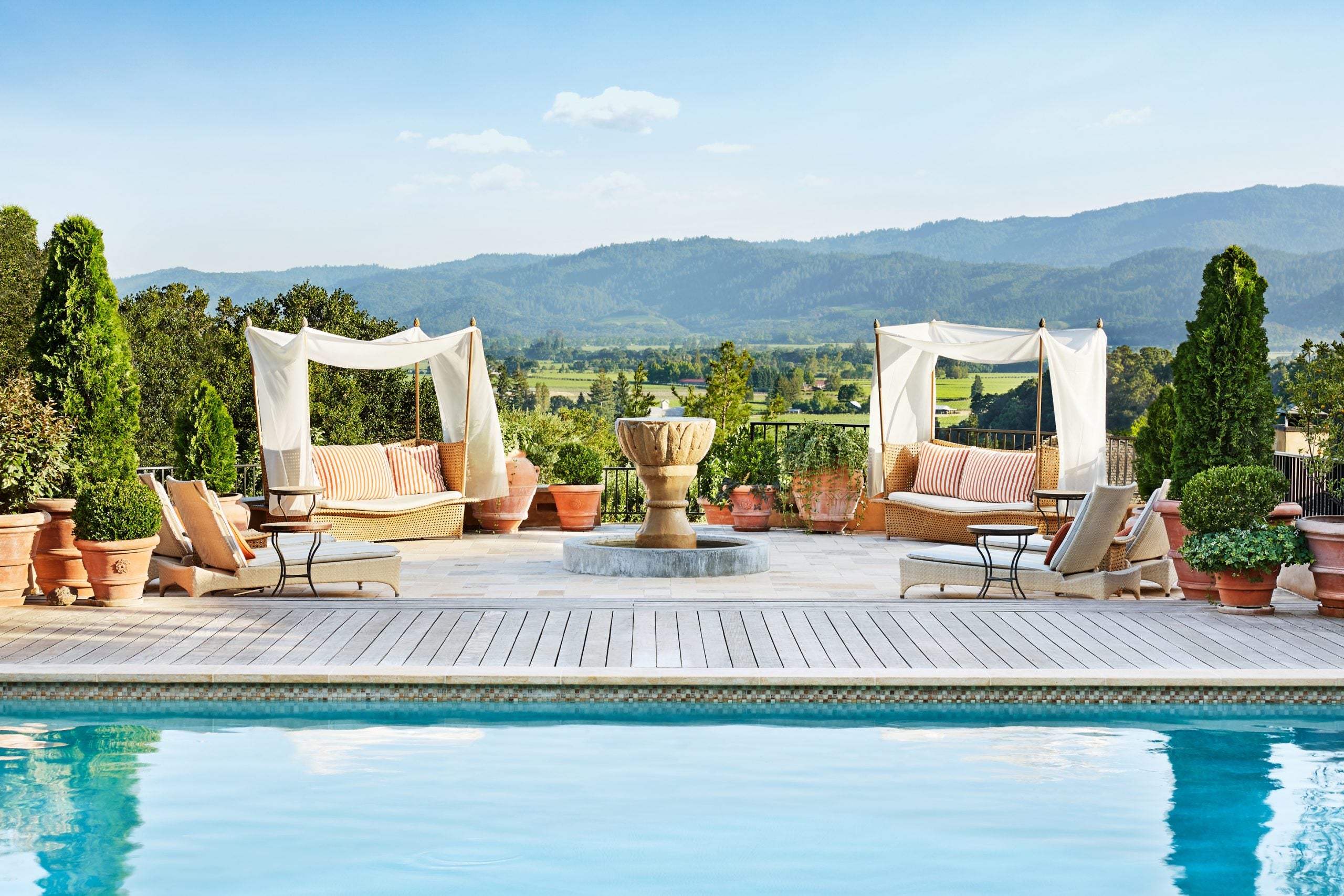 Swimming pool at luxury resort with cabanas overlooking Napa Valley, California