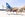 Alaska Airlines employees jump in front of plane with new livery celebrating gay pride.