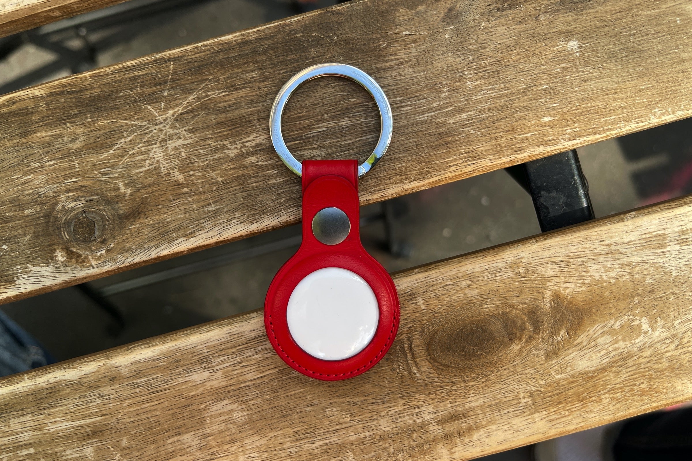 Apple AirTag in a red Key Ring holder