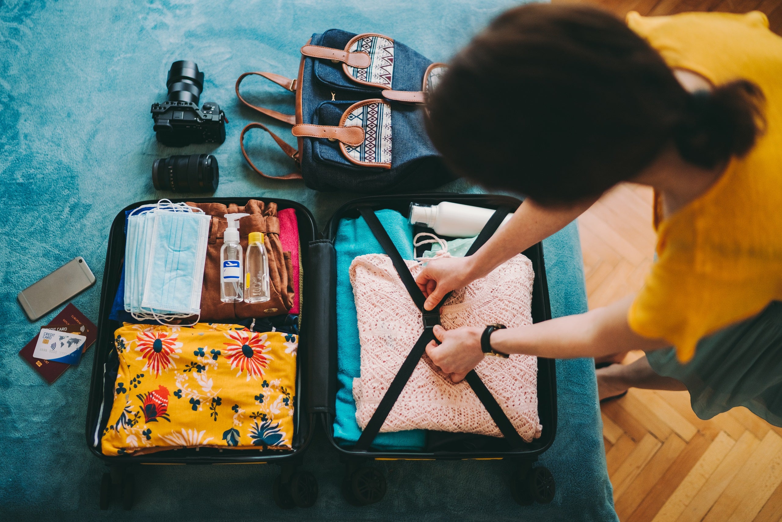 Woman packing suitcase for travel