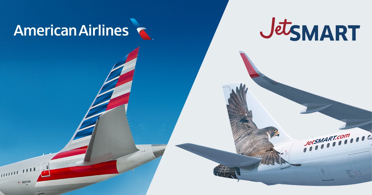 A mockup of an American Airlines aircraft tail and a JetSMART aircraft tail next to each other.