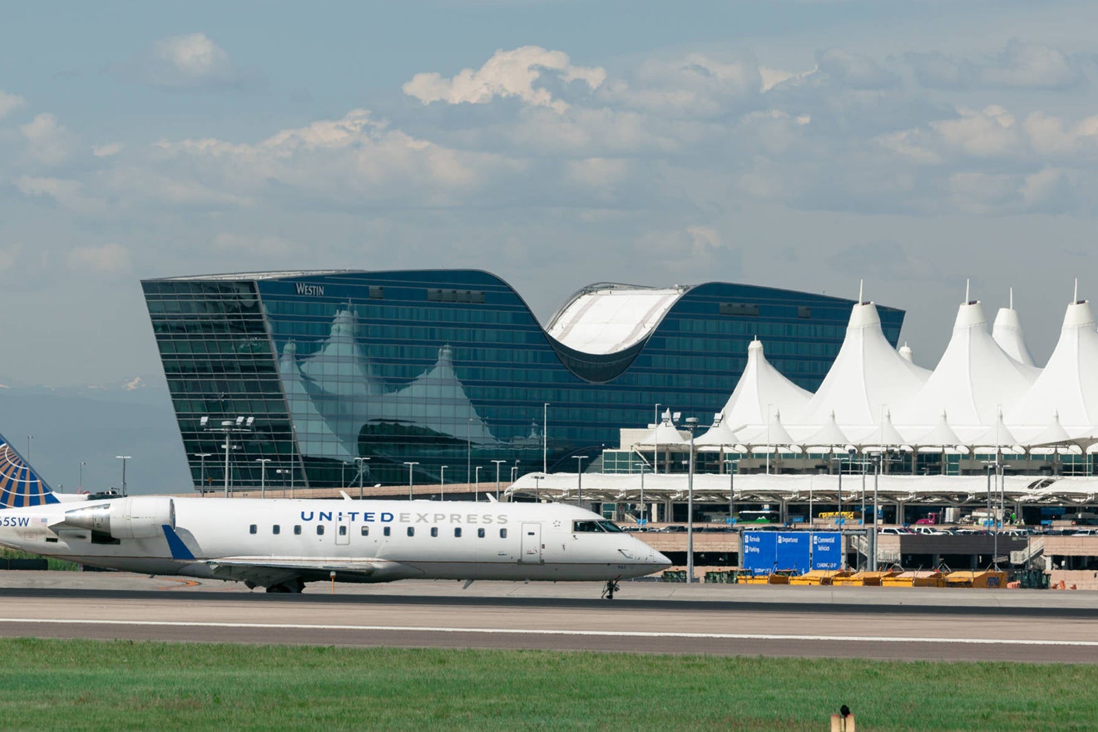 A plane taxis on the runway at Denver's airport
