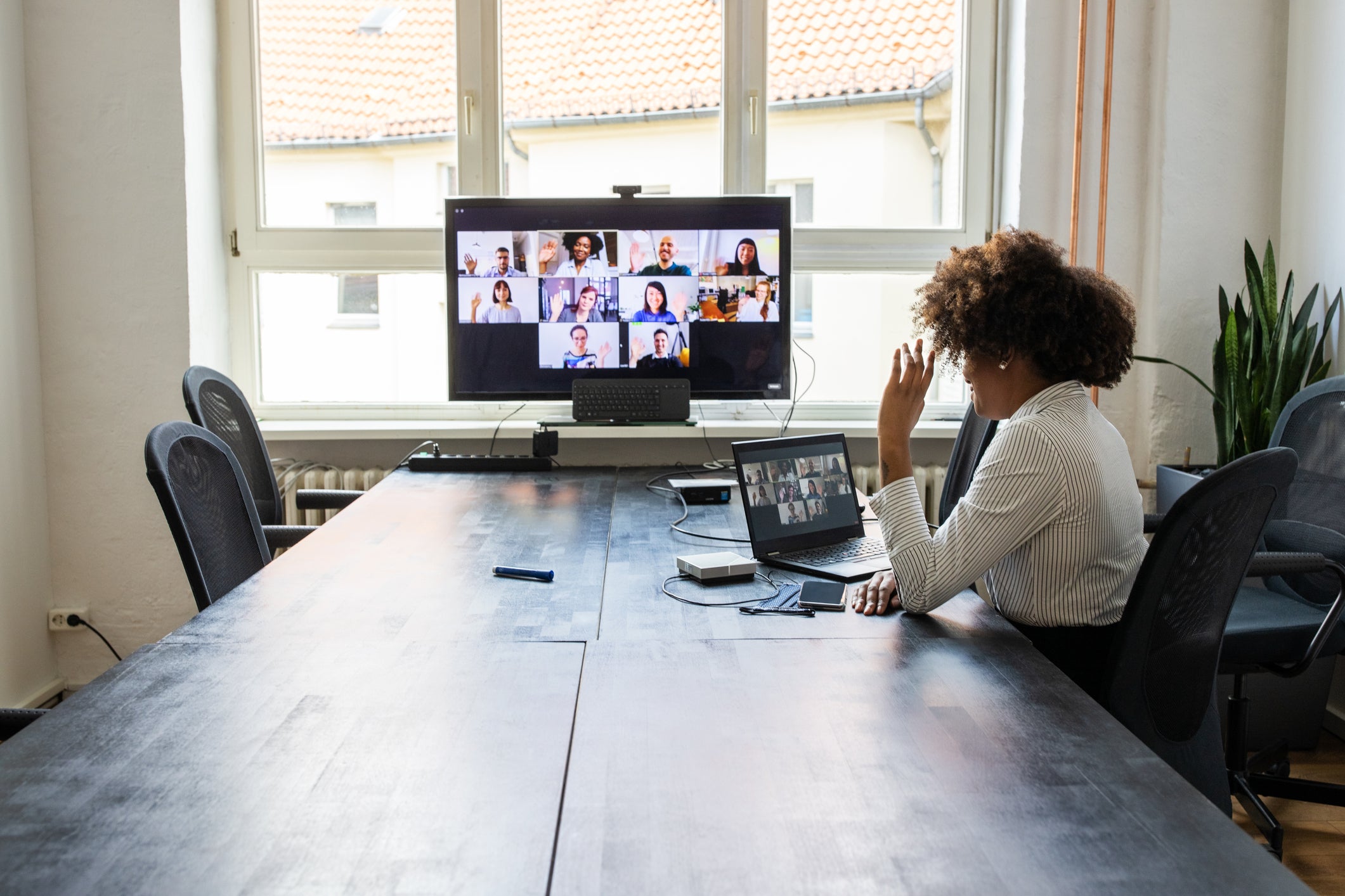 Meeting over a video call in office post pandemic