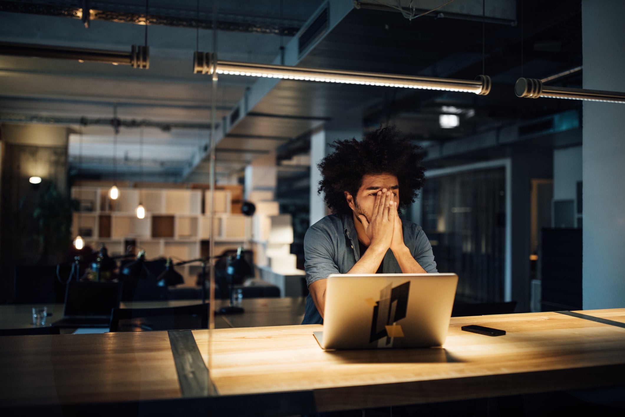 Businessman working late on laptop