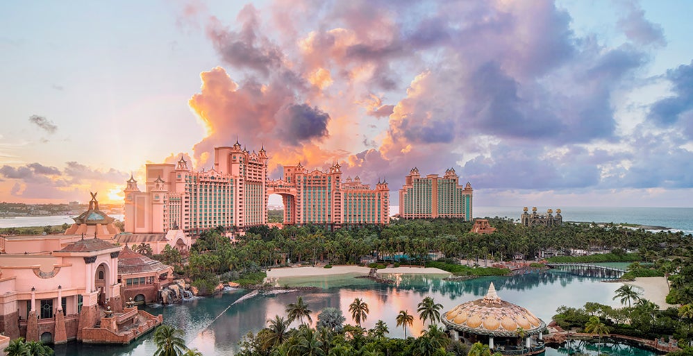 An image of the Atlantis resort from the sky. Pink blue clouds in the background.