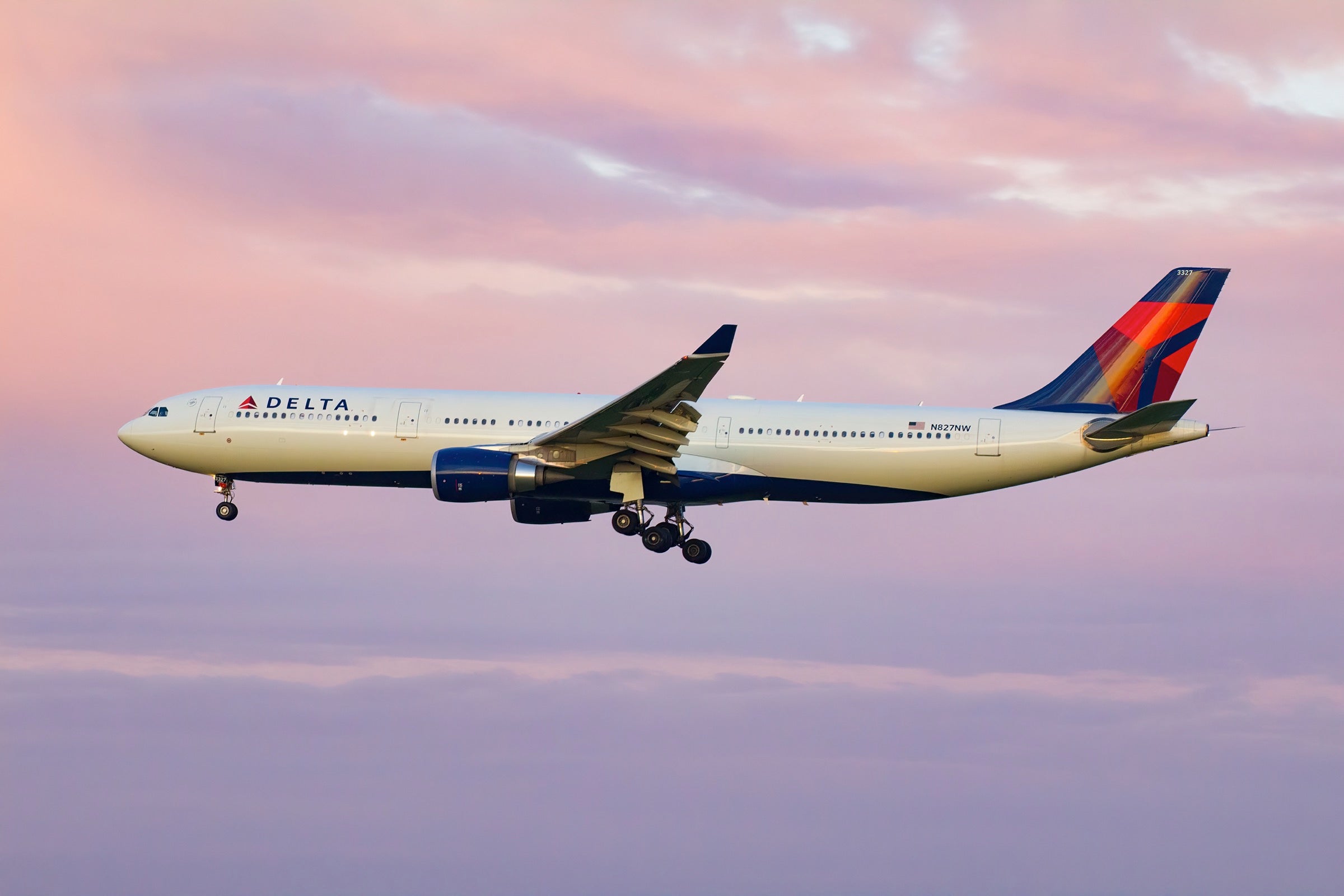 Delta A330 with pink clouds in the background