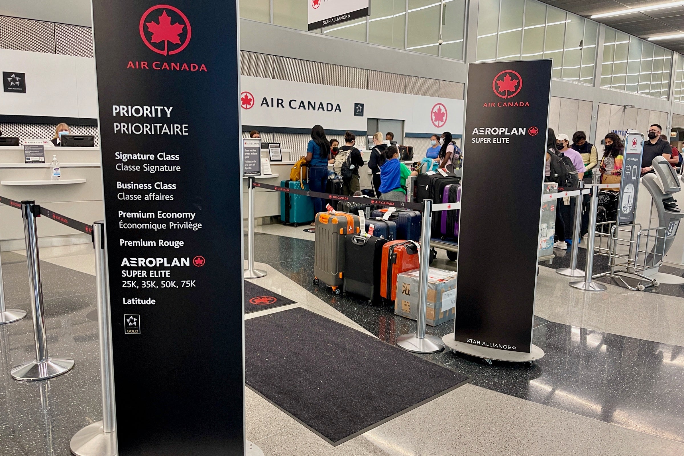 Elite signs at Air Canada baggage
