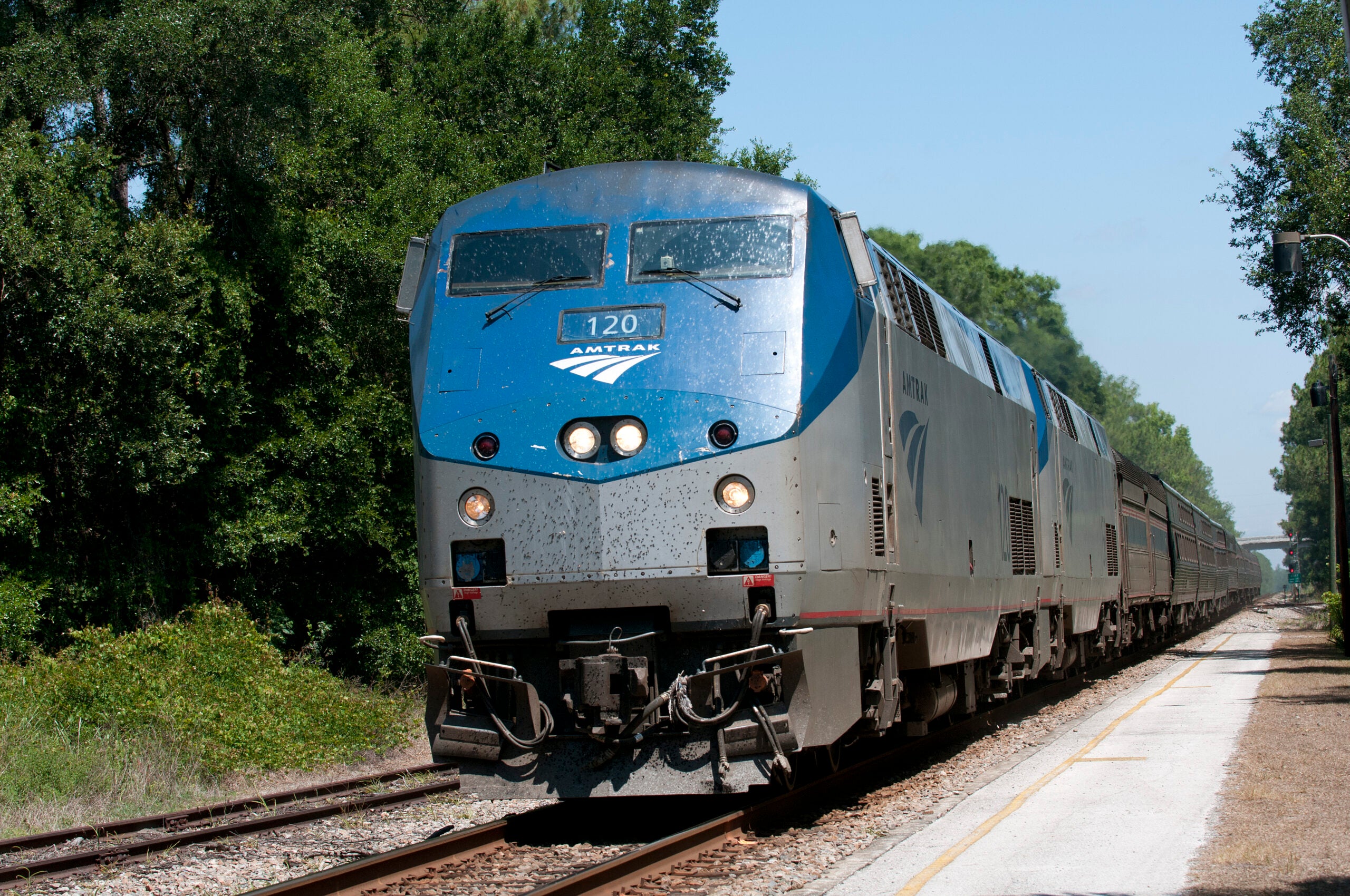 Amtrak railroad passenger train approaching DeLand rail Station Florida USA