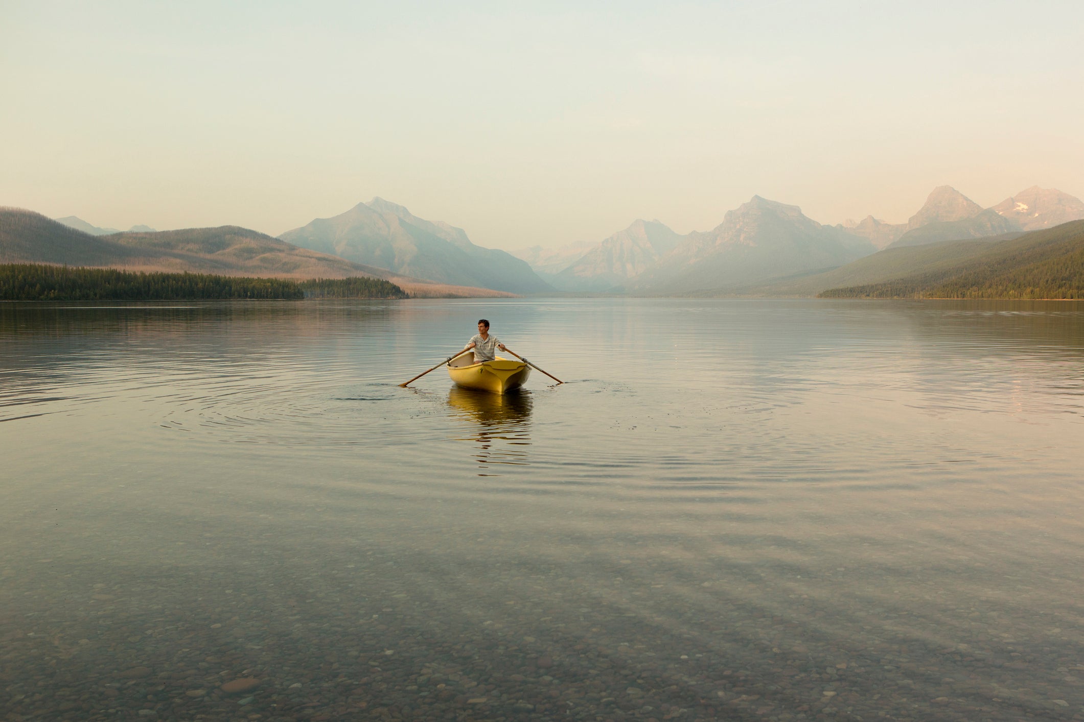 A man in a row boat.