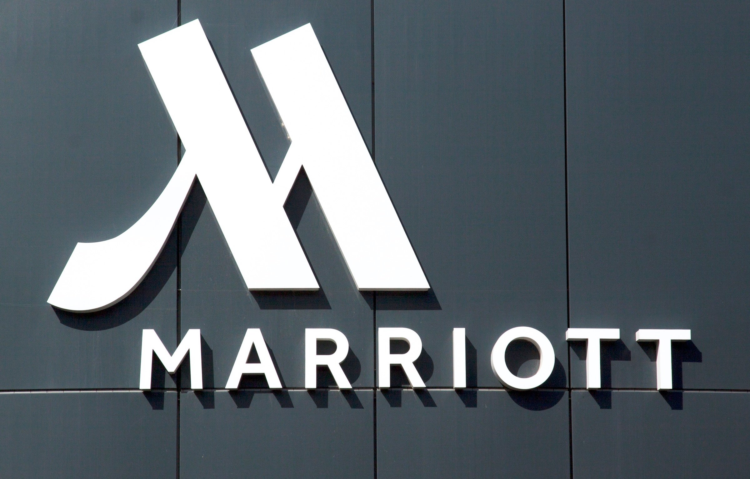 A Marriott Hotel Sign on a Gray Building