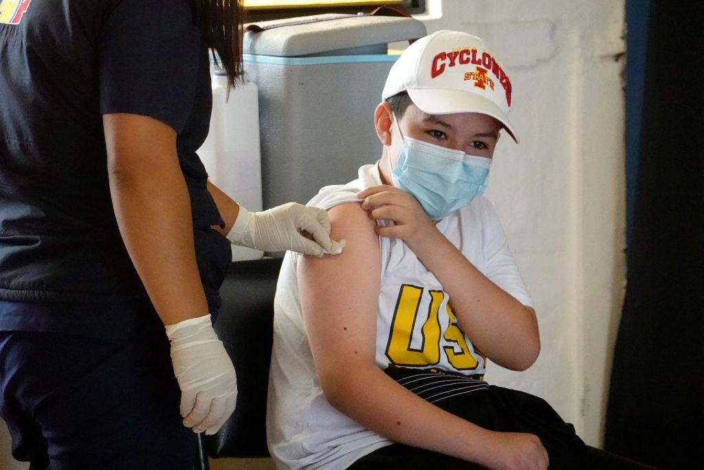 Boy receives vaccination