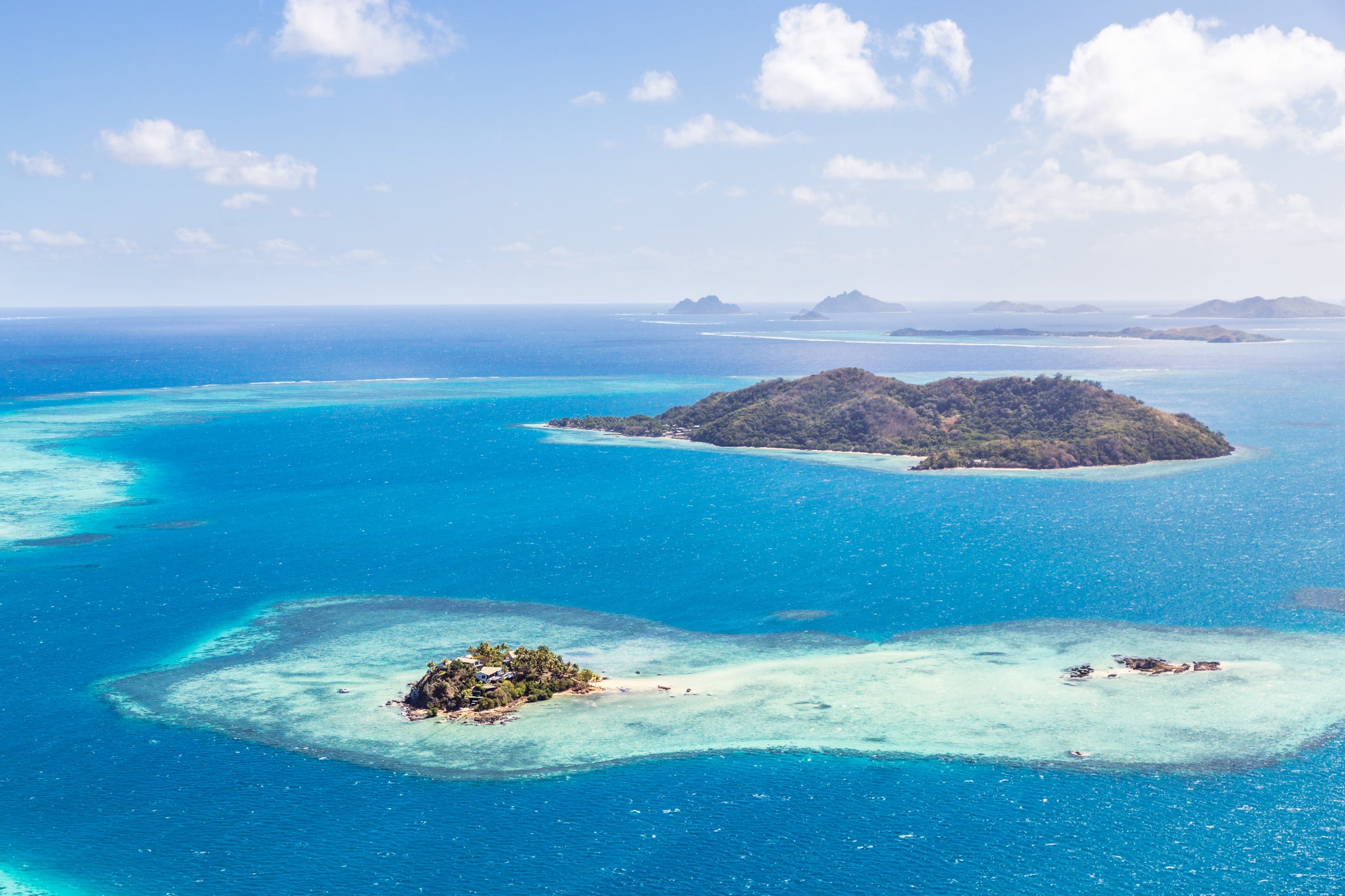 Aerial of island with tourist resort, Fiji