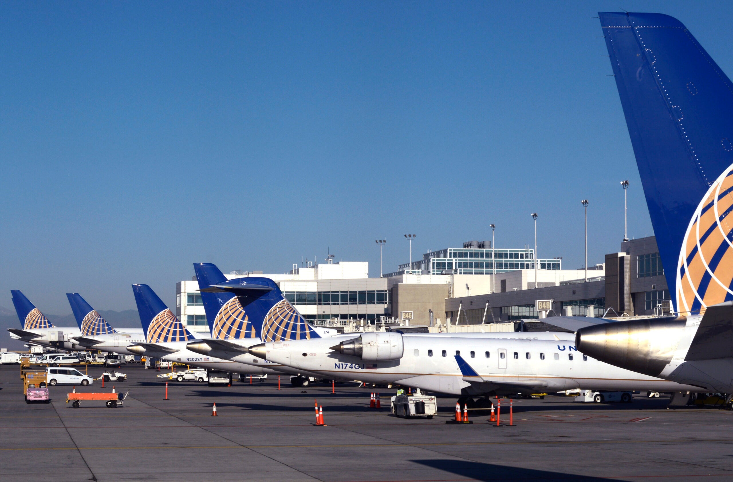 A row of United Airlines passenger planes at Denver International Airport