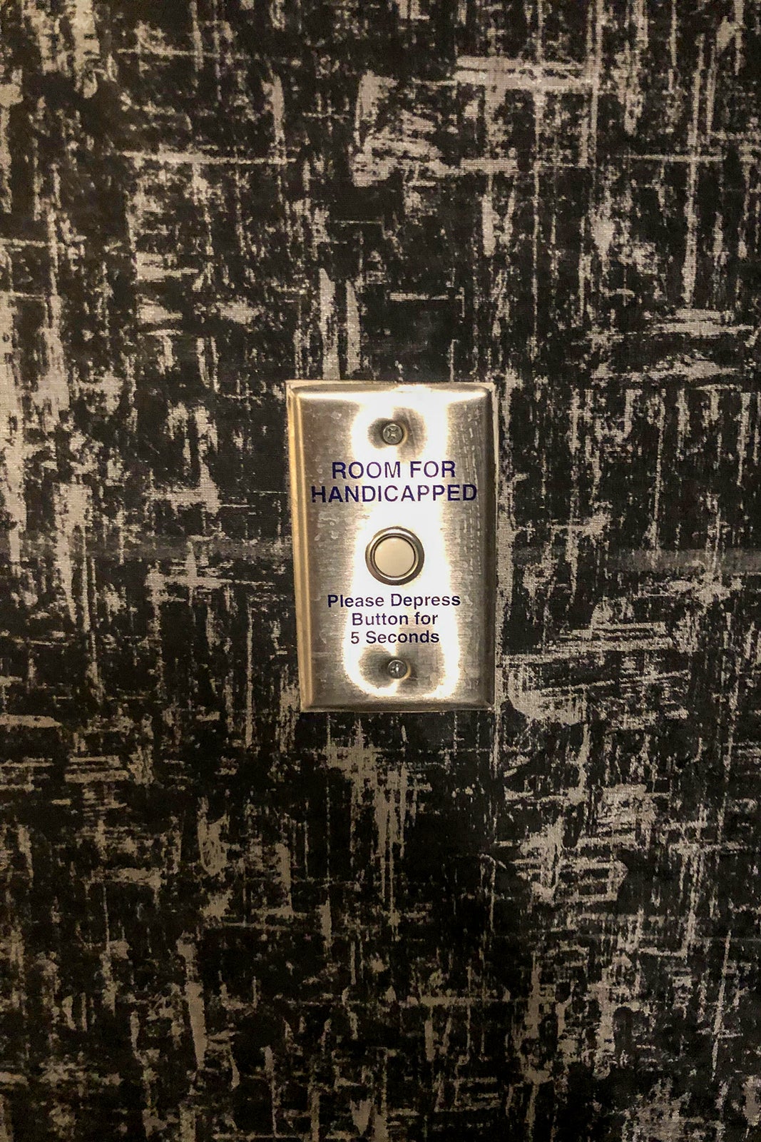Doorbell for handicapped guests at The Clancy hotel.