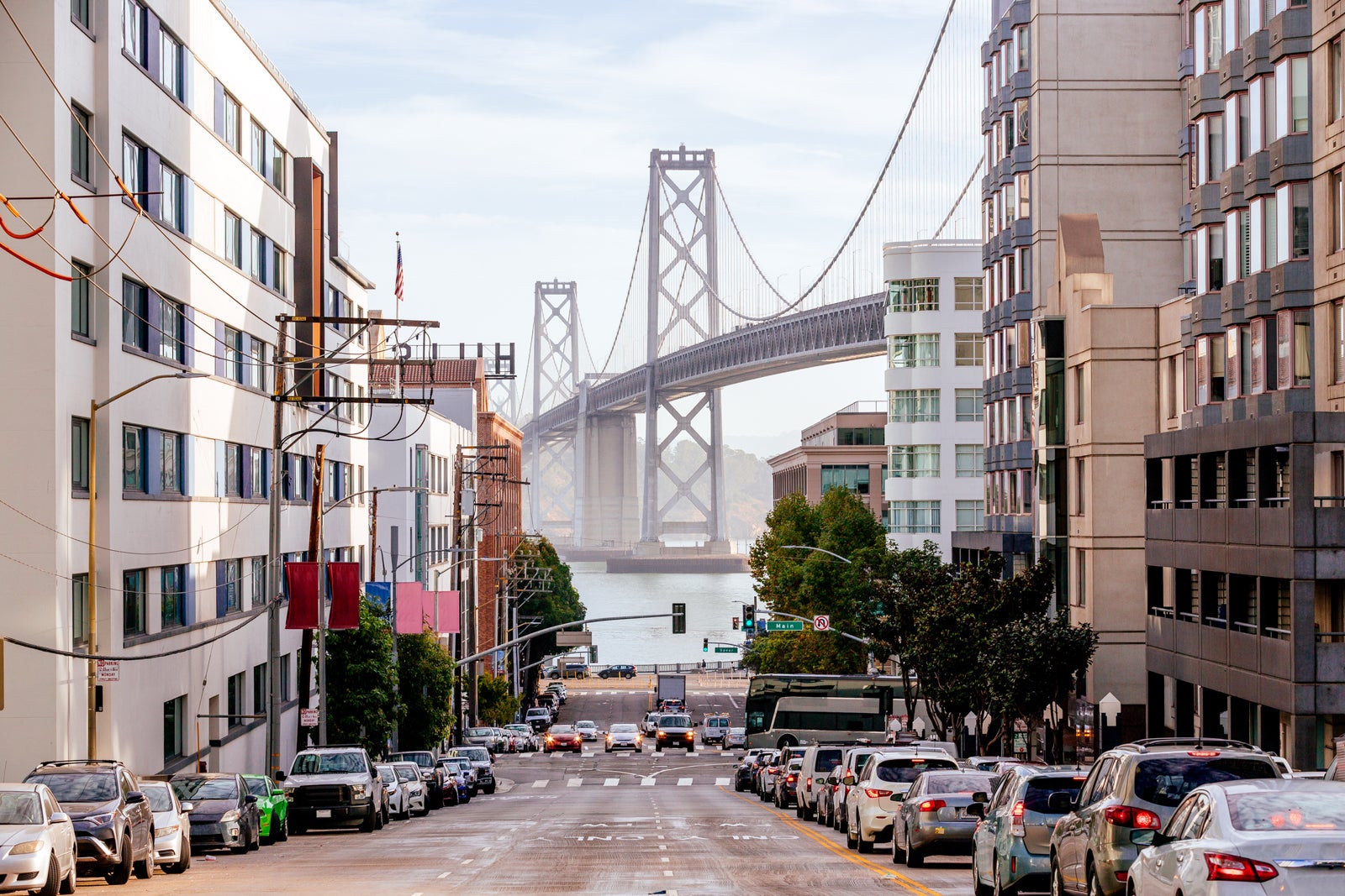 Street in downtown of San Francisco with San Francisco-Oakland Bay Bridge in the center, California, USA