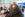 grandfather hugging family member at airport