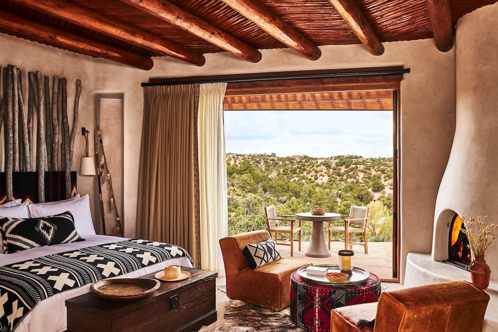 room overlooking mountains with adobe fireplace