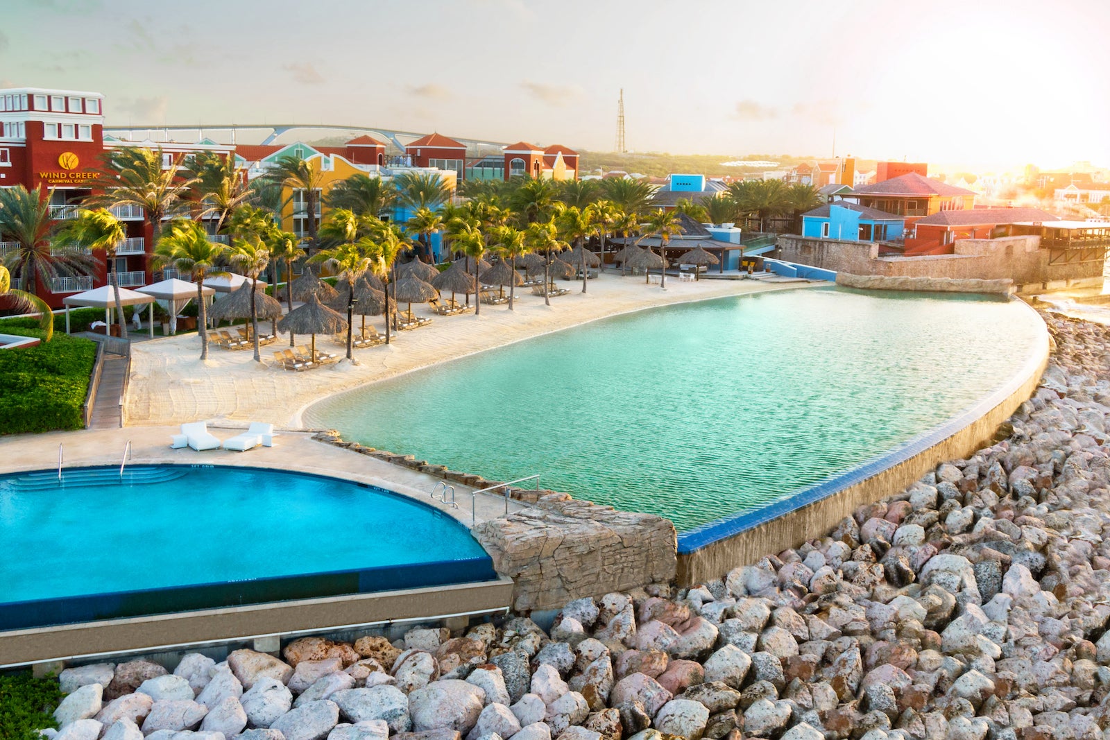 Infinity pool overlooking rocks and beach resort